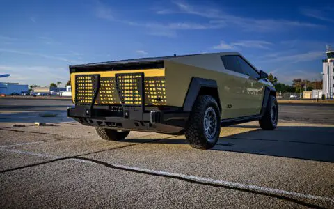 Dune Sand Vinyl Wrapped Cybertruck with Carbon Fiber Fenders, INVINCIBLE Rear Steel Bumper with Swing Arms on 18 inch UP-03 Forged Beadlock Wheels in Satin Titanium