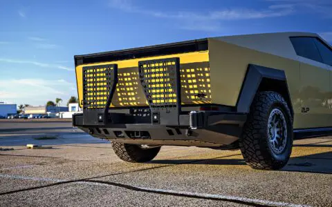 Dune Sand Vinyl Wrapped Cybertruck with Carbon Fiber Fenders, INVINCIBLE Rear Steel Bumper with Swing Arms on 18 inch UP-03 Forged Beadlock Wheels in Satin Titanium