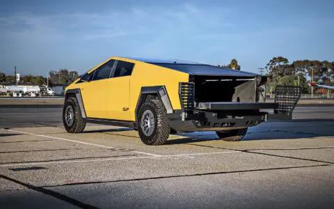 Dune Sand Vinyl Wrapped Cybertruck with Carbon Fiber Fenders, INVINCIBLE Rear Steel Bumper with Swing Arms on 18 inch UP-03 Forged Beadlock Wheels in Satin Titanium