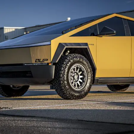 Dune Sand Vinyl Wrapped Cybertruck with Carbon Fiber Fenders, INVINCIBLE Rear Steel Bumper with Swing Arms on 18 inch UP-03 Forged Beadlock Wheels in Satin Titanium