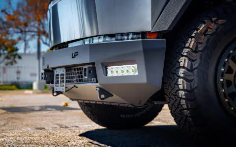 Cybertruck with Front and Rear Invincible Steel Bumpers, UP-03 Beadlock Forged Wheels, and Bedliner Finished Carbon Fiber Parts