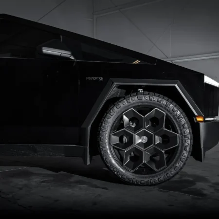 Tesla Cybertruck showcasing 24-inch CYBRHEX Satin Black Wheels by Unplugged Performance – Rear angle