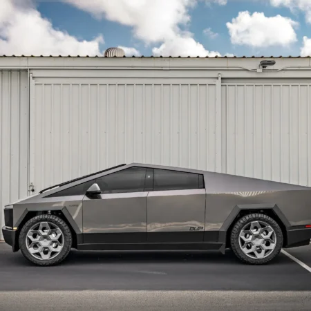 Tesla Cybertruck in Magnesium Grey Wrap featuring Satin Titanium 24-inch CYBRHEX Forged Wheels – Rear angle