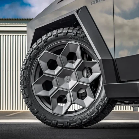 Tesla Cybertruck in Magnesium Grey Wrap with Satin Titanium 24-inch CYBRHEX Forged Wheels – Front side view