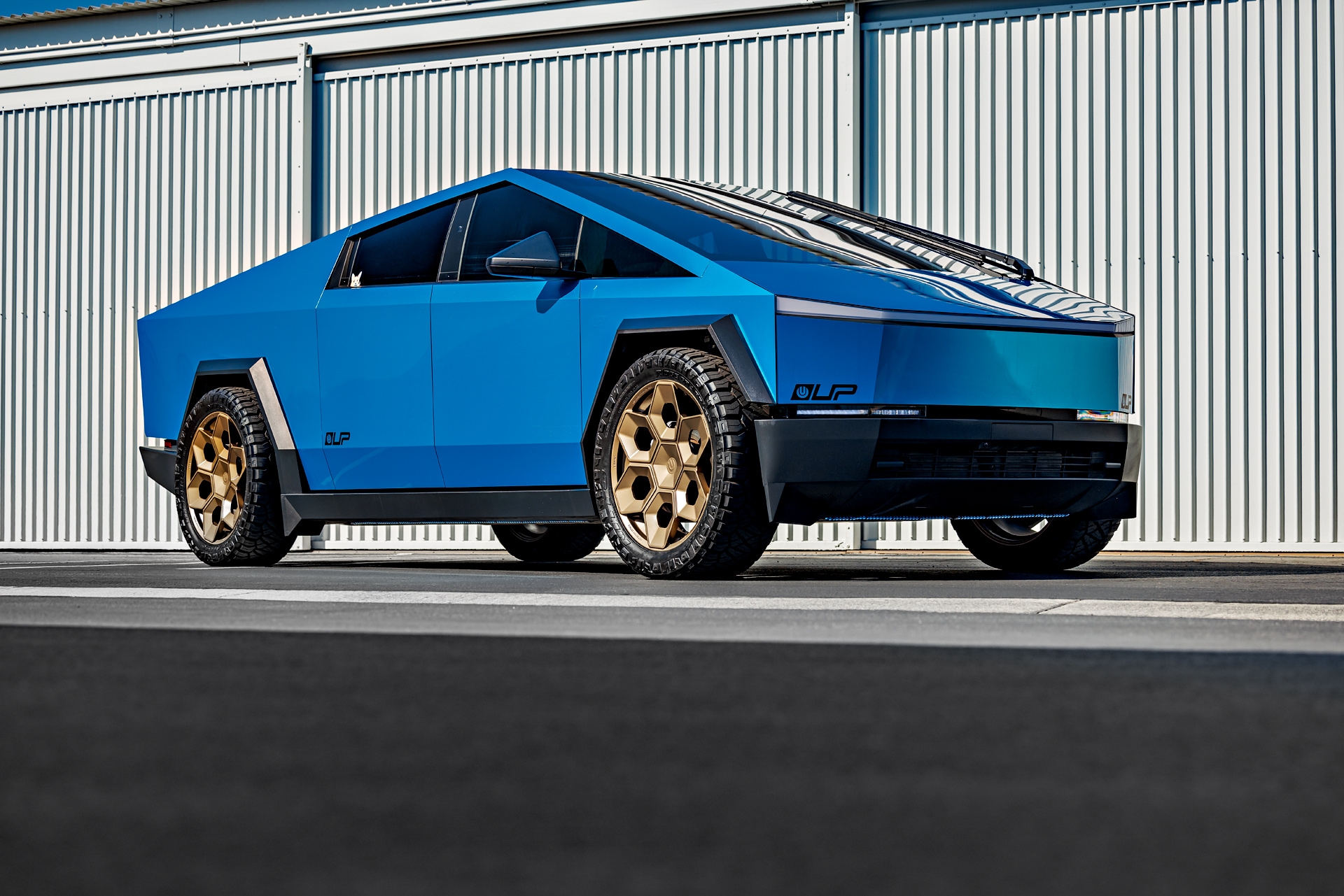DennisCW’s Gloss Metallic Blue Tesla Wrapped Cybertruck on 24 inch CYBRHEX Forged Wheels in Satin Bronze
