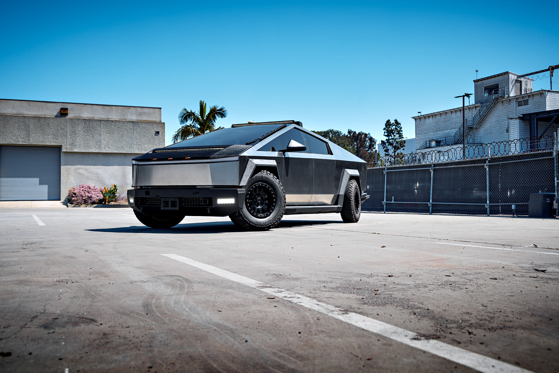 Cybertruck with Front and Rear Invincible Steel Bumpers, UP-03 Beadlock Forged Wheels, and Bedliner Finished Carbon Fiber Parts