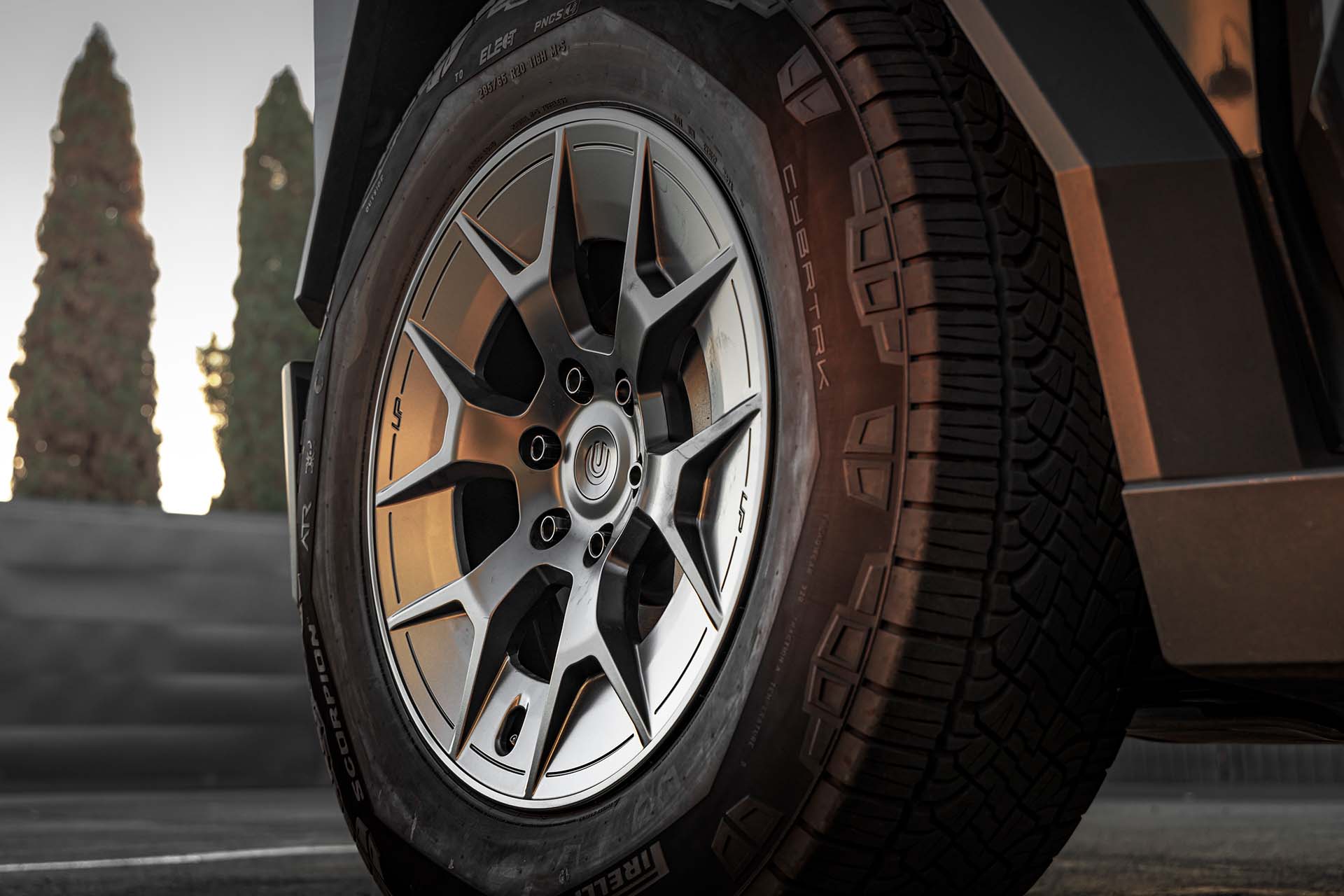 UP-RW Cyber Road Warrior: The Forged Cybertruck Wheel That Doesn't Sacrifice Range 5 Gloss Black Tesla Cybertruck on 20-Inch UP Forged UP-RW Wheels in Satin Black, Satin Gunmetal Ring